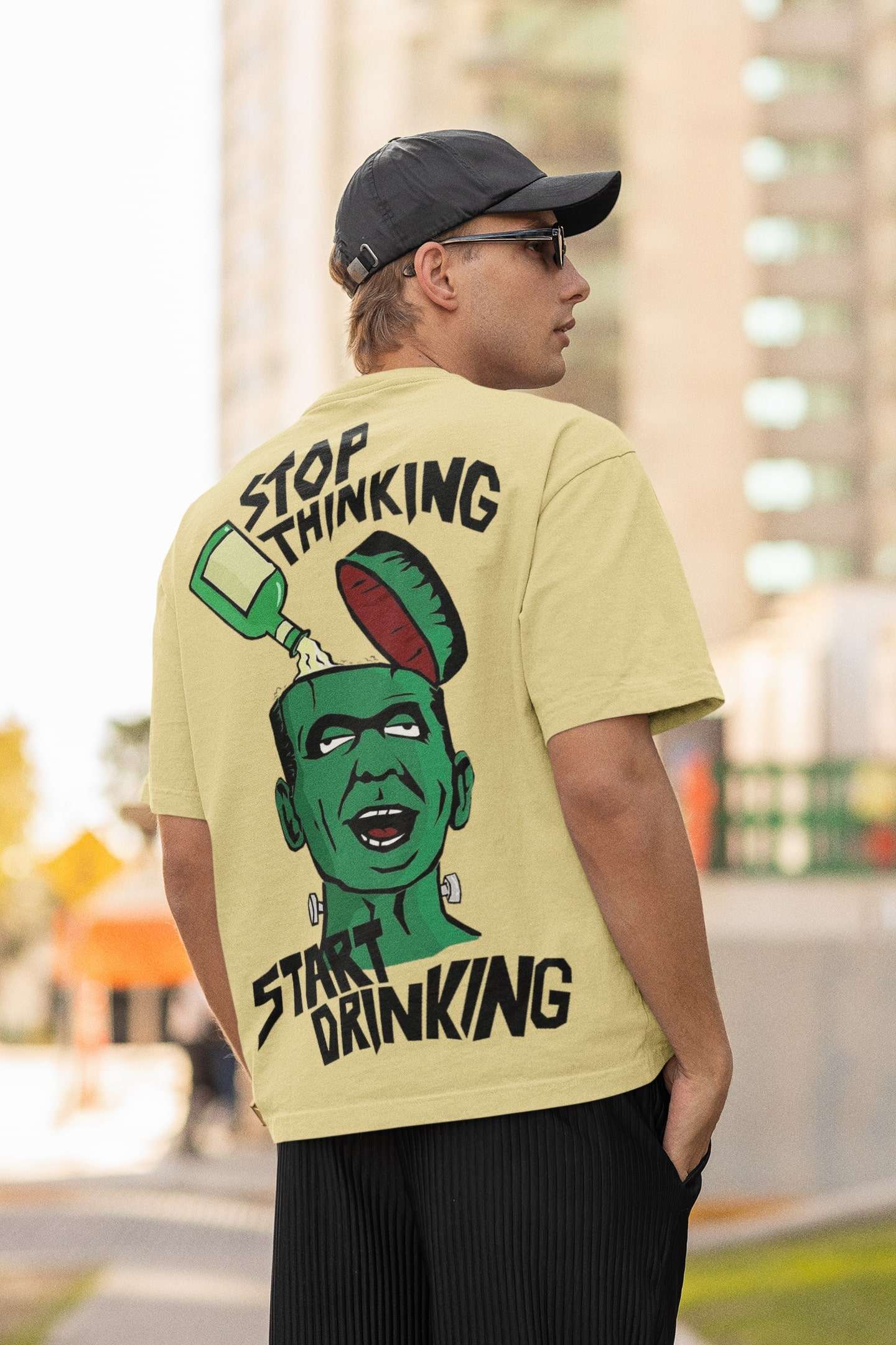 back-view-mockup-of-a-man-wearing-an-oversized-t-shirt-and-sunglasses-m25264 (23) Oversized T-shirts for Men online